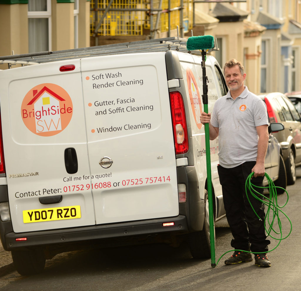 Man with van and cleaning equipment